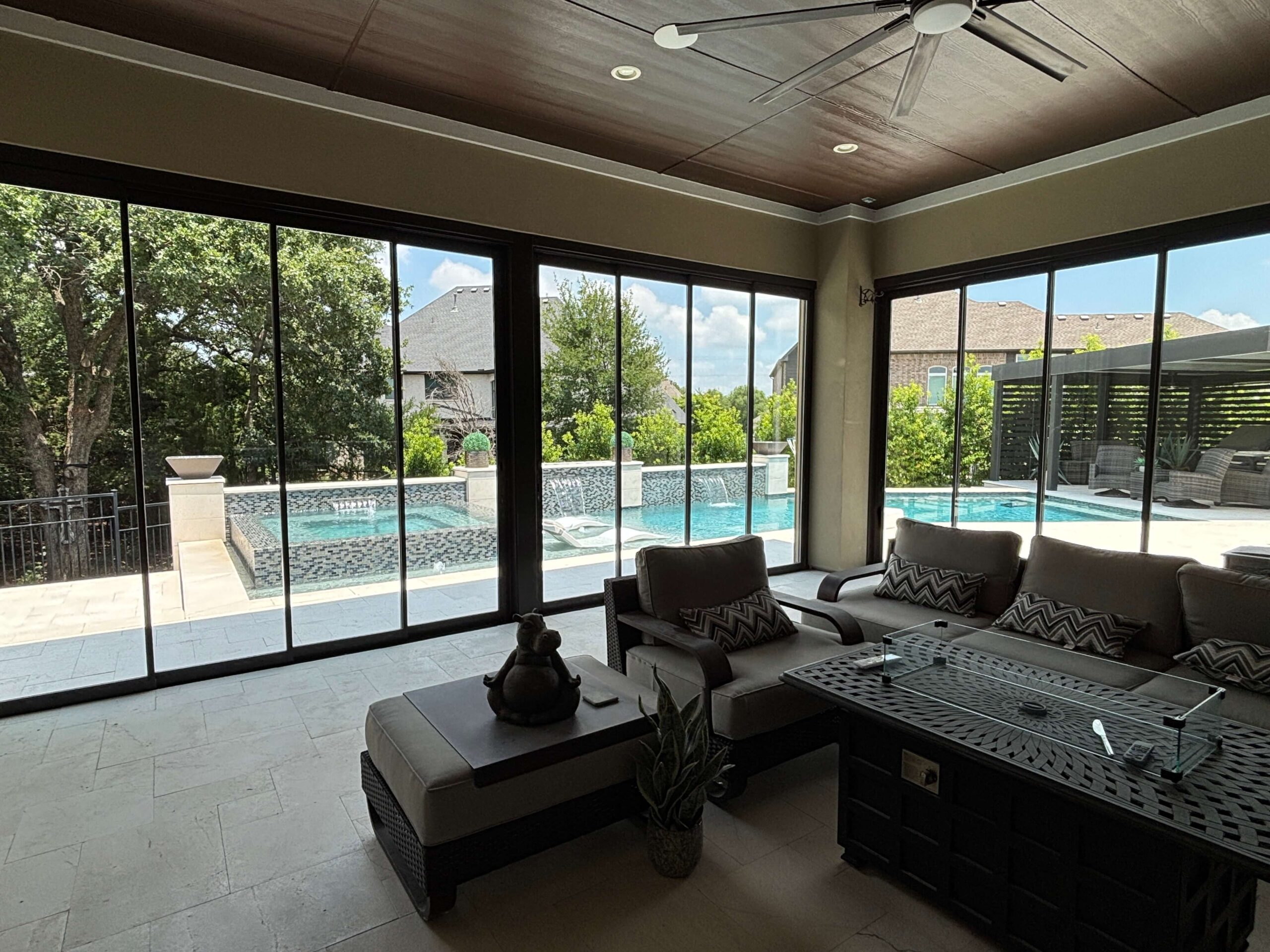 Frameless glass wall installation by Double T Screened Patios in Flower Mound